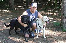 Dogs and owner walking at Kinns Road Park