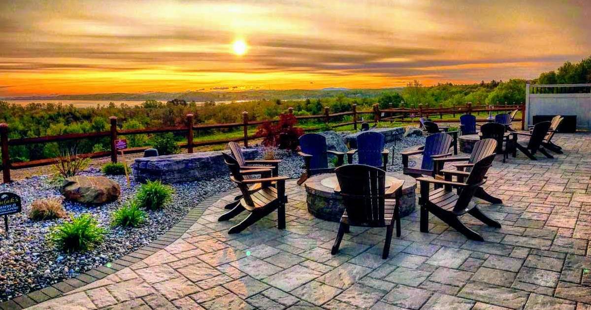 chairs and table on patio at sunset